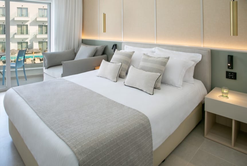 a bed with white pillows