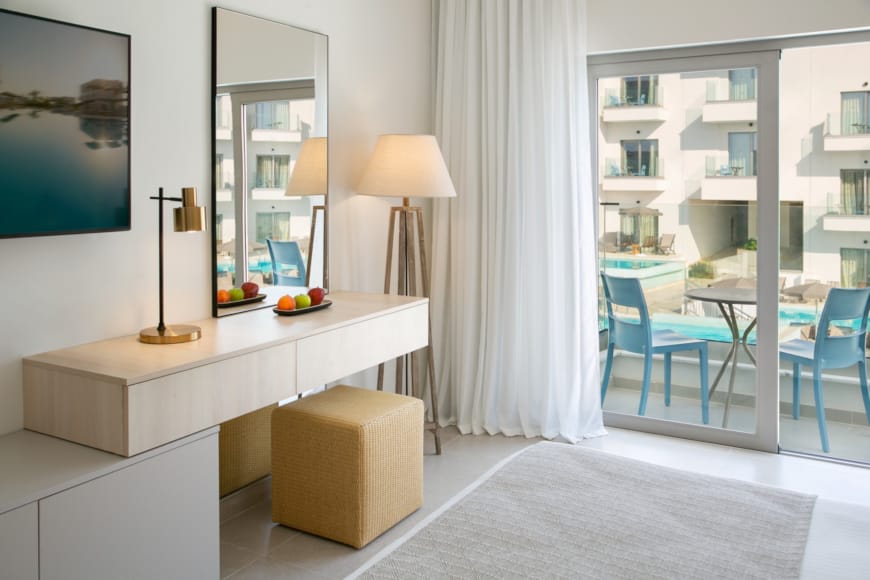 a room with a white table and chairs