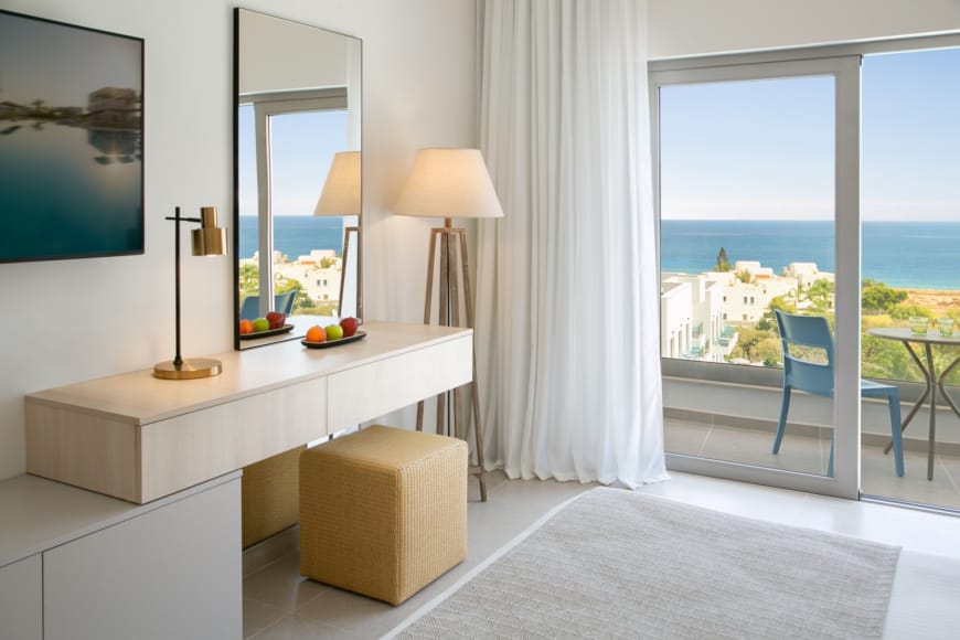 a white room with a white table and a white couch