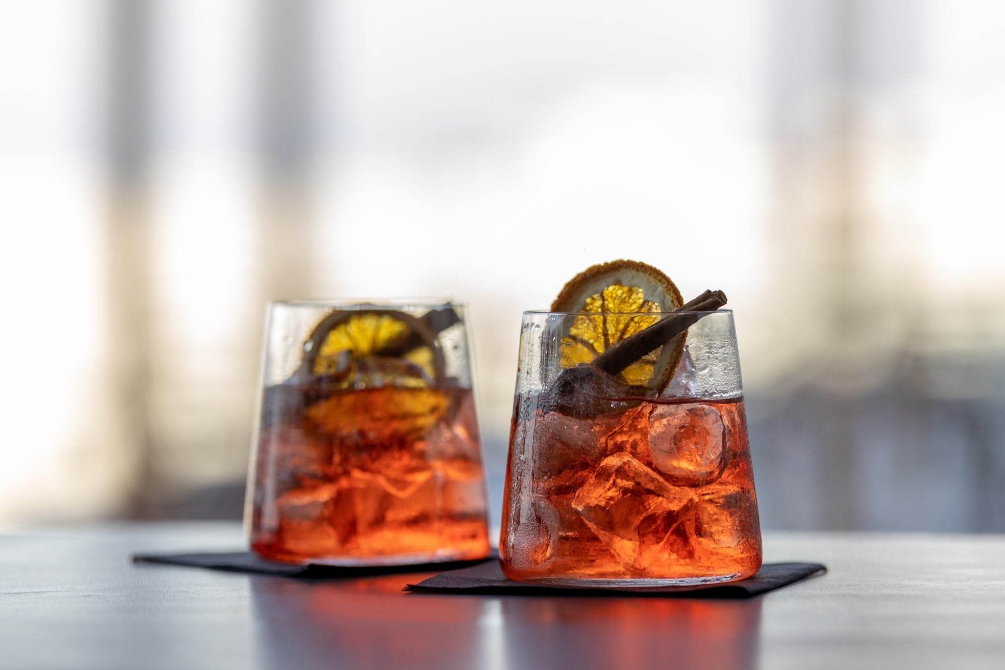 a couple of glasses with liquid in them