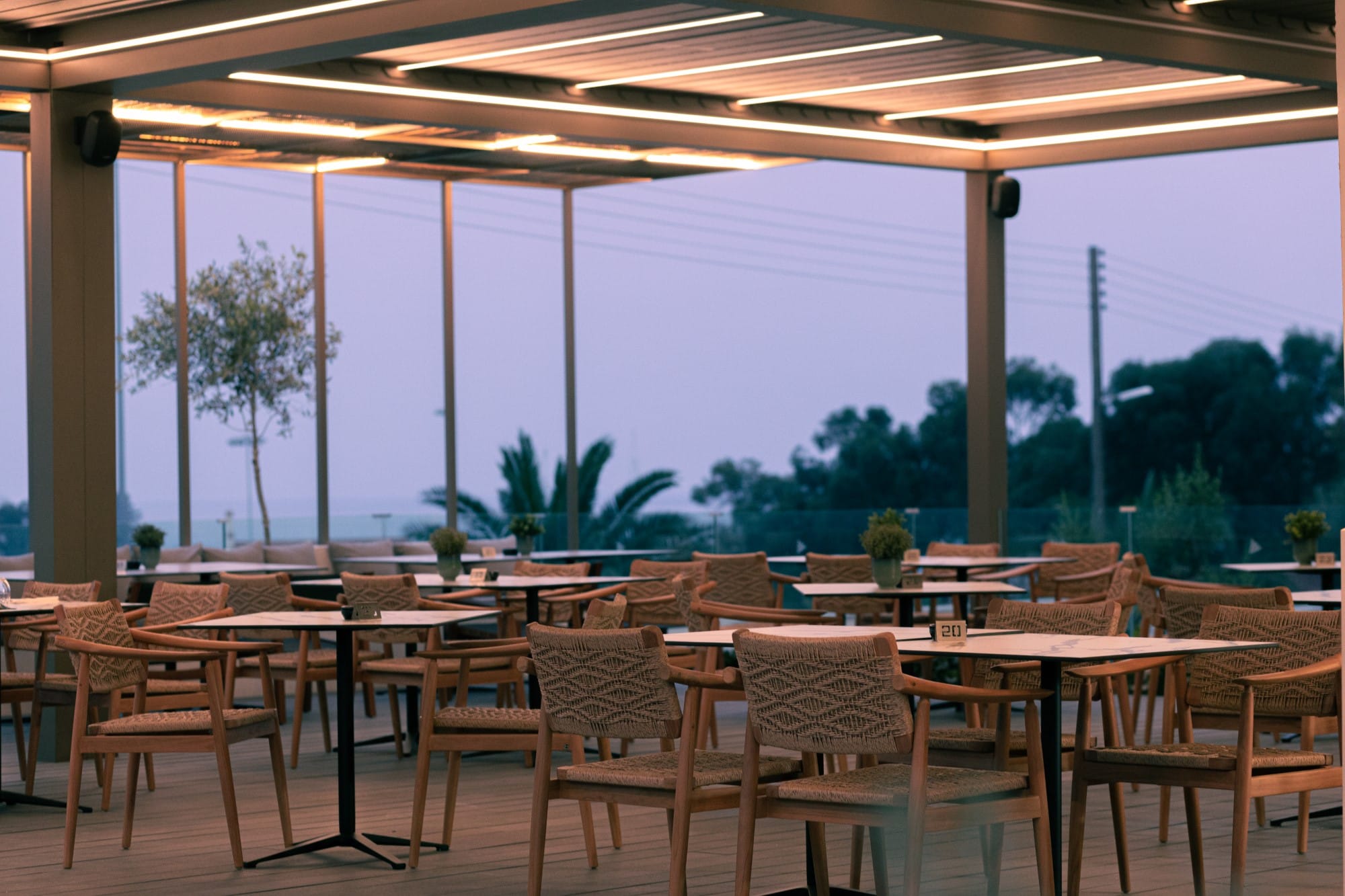 a group of tables and chairs outside