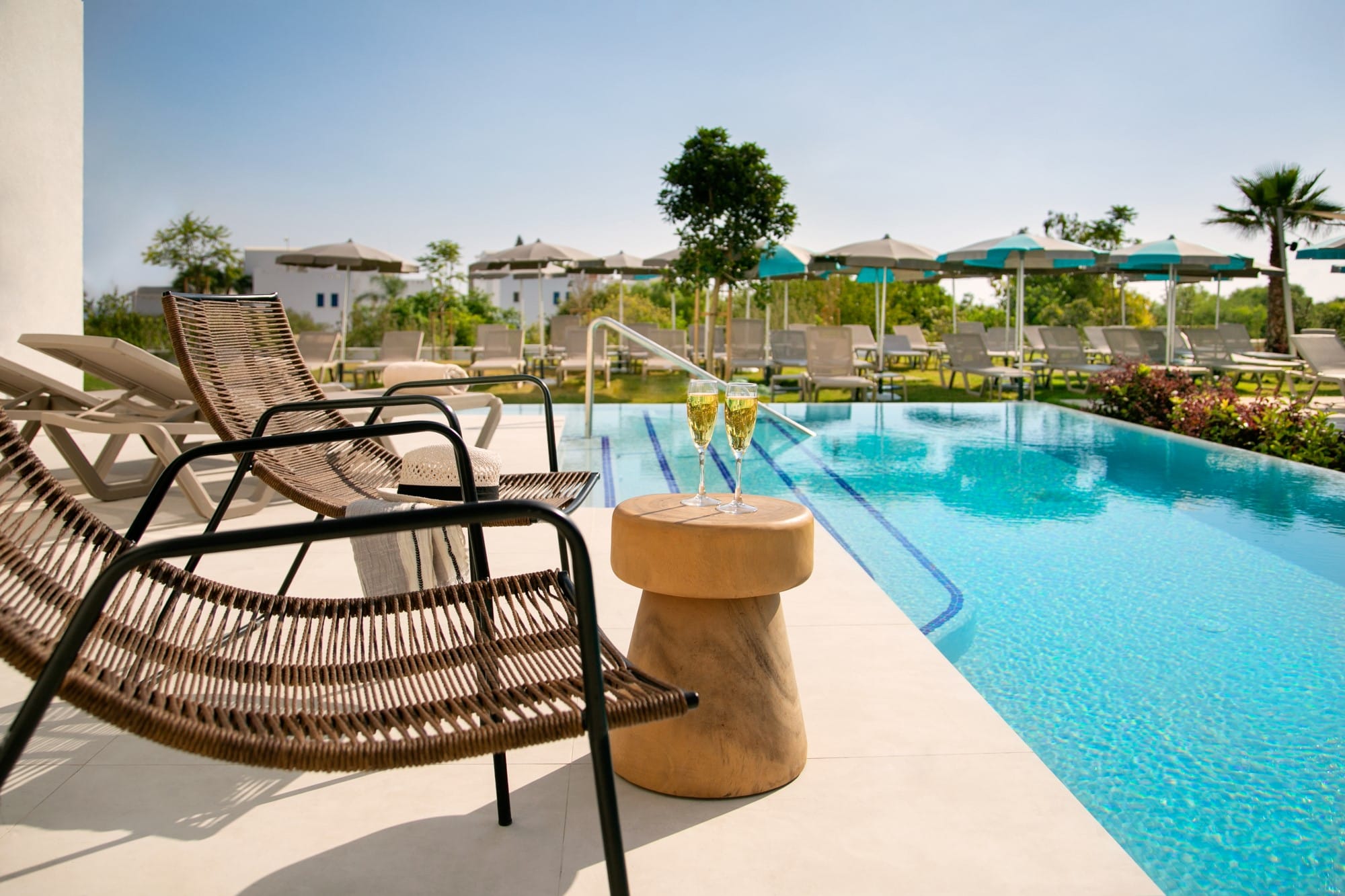 a pool with chairs around it