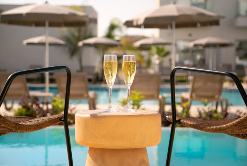 a table with glasses and umbrellas