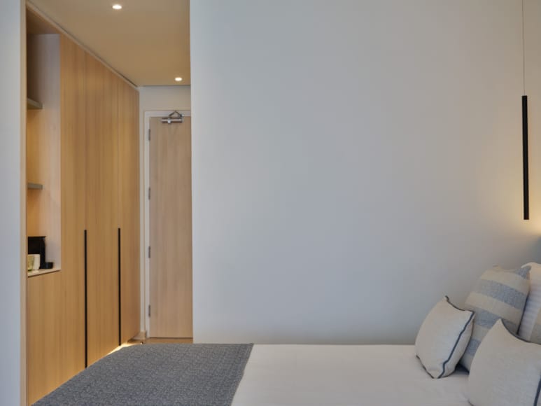 a room with a bed and a door