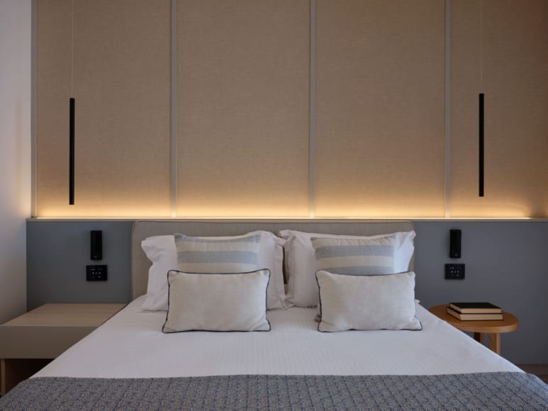 a bed with white pillows