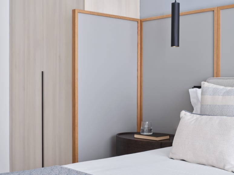 a bed with a white bed and a white pillow