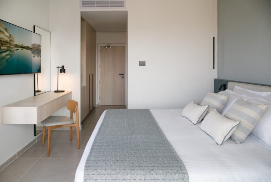 a room with a bed and a desk