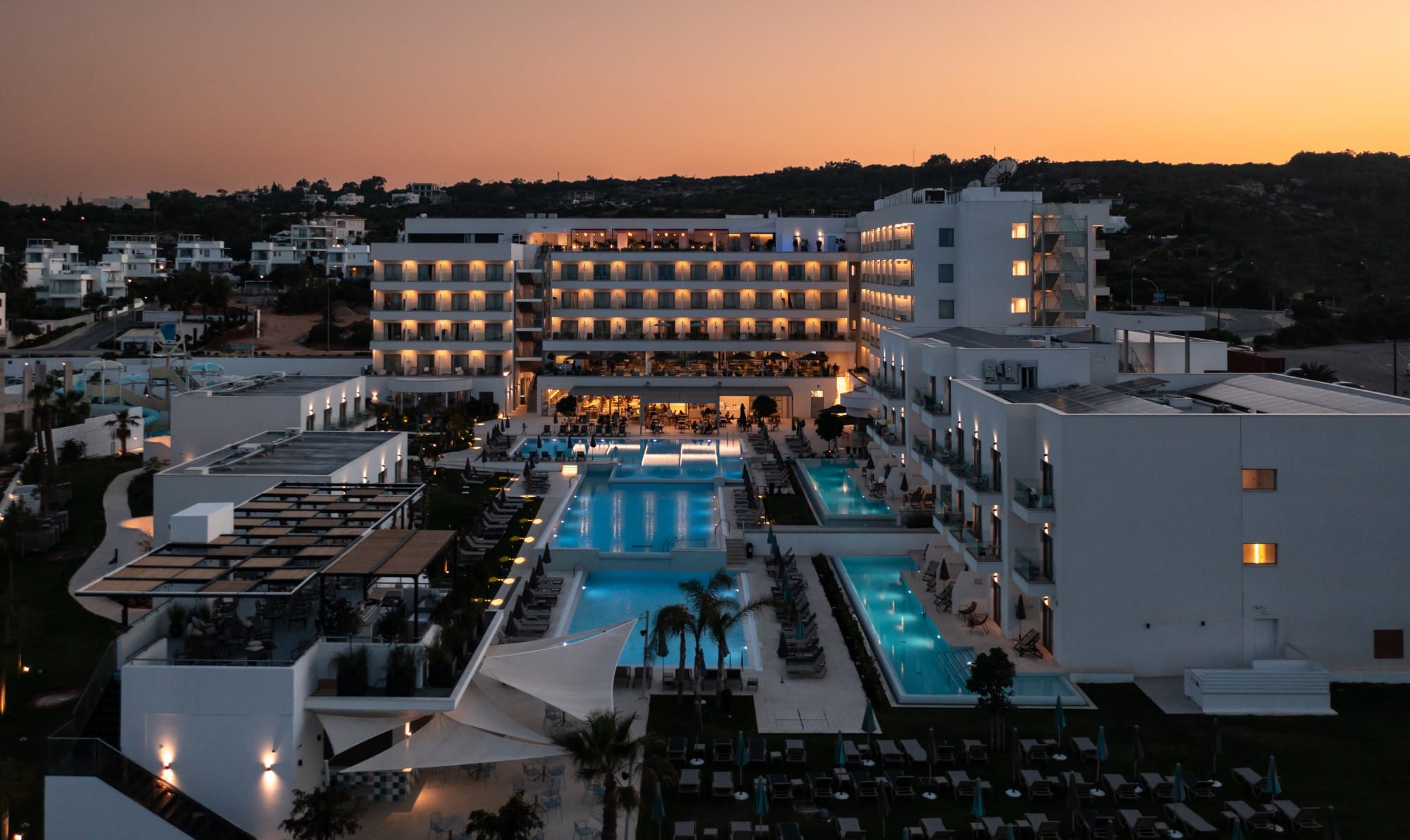 a large building with a pool in the middle of it