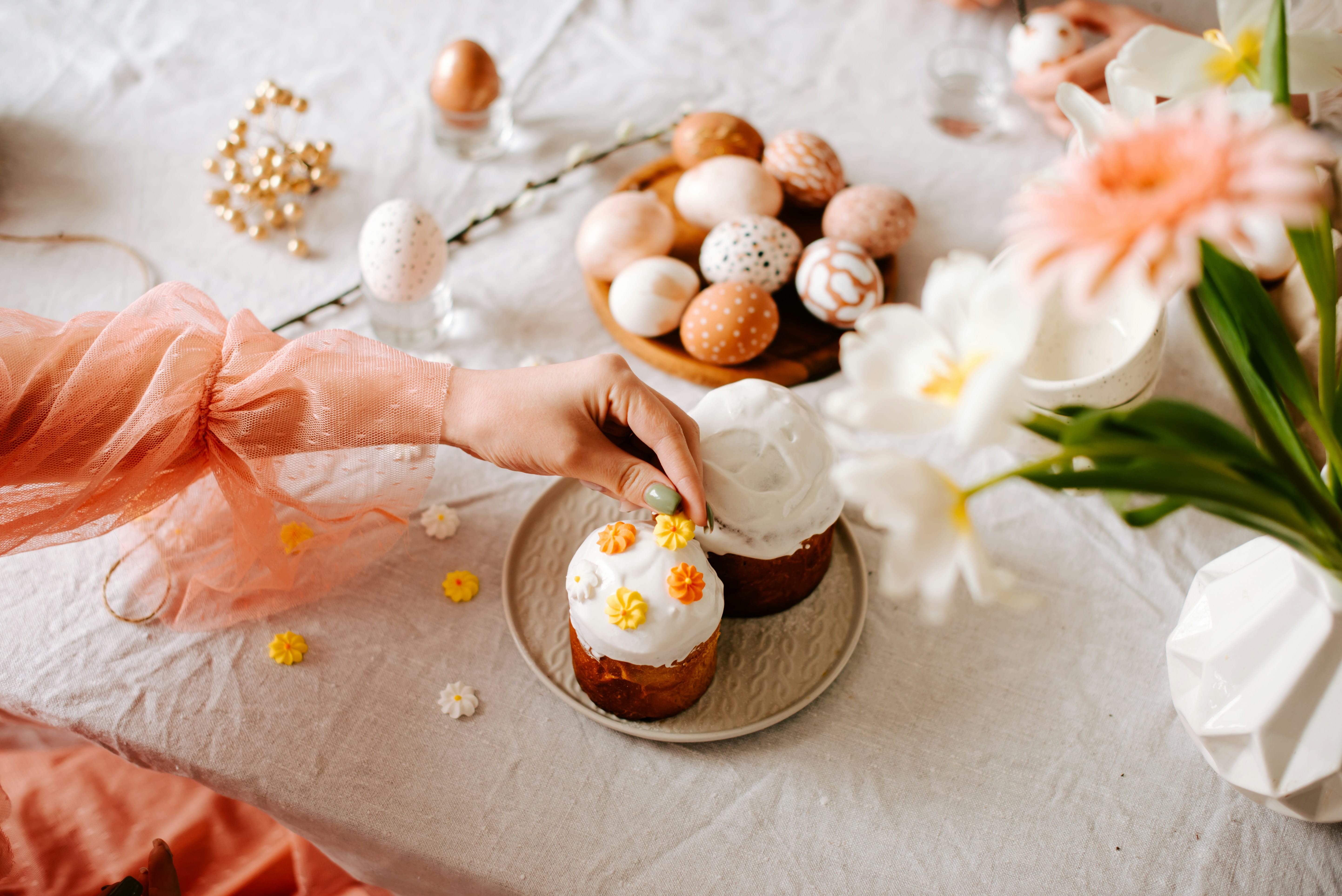 a person making cupcakes