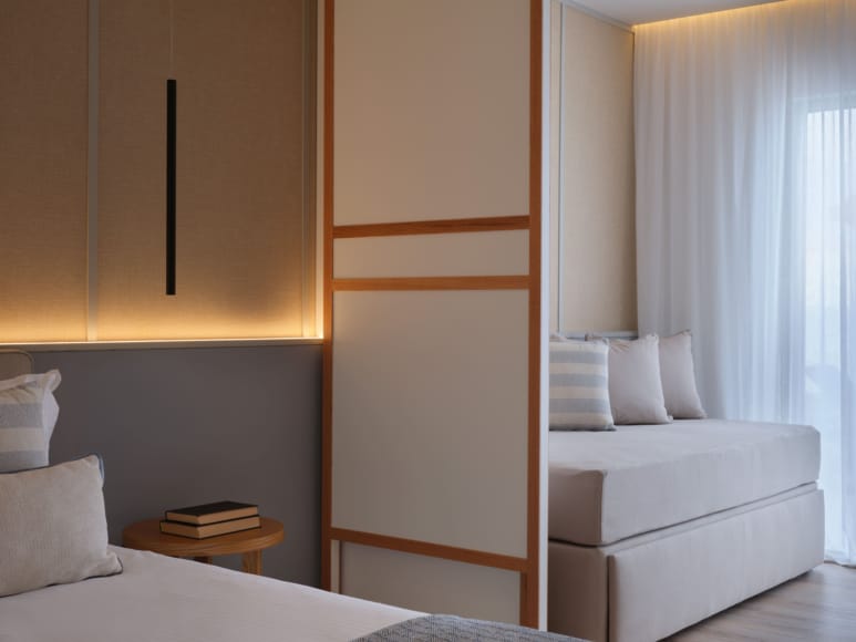 a room with a bed and a white bed