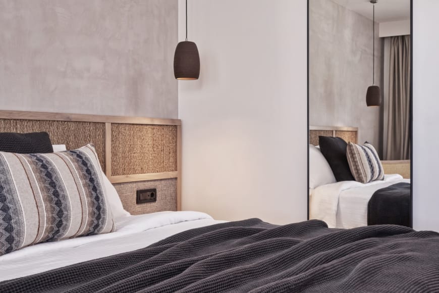 a bed with a couple of lamps