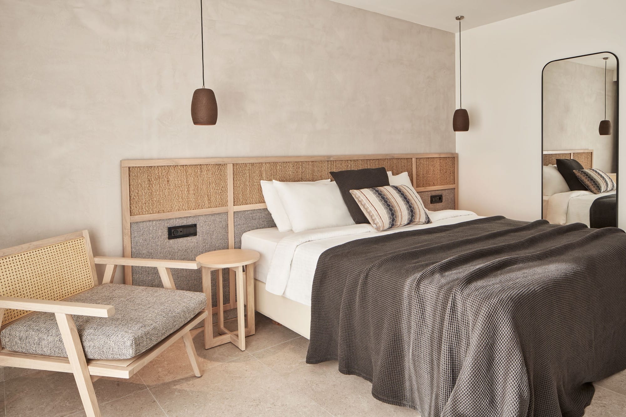 a room with a bed and a chair