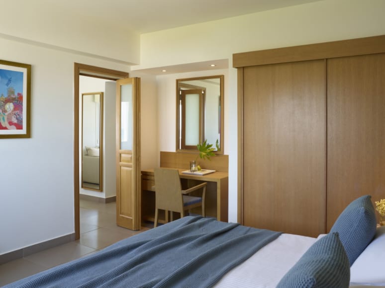 a bedroom with a bed and a desk