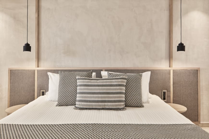 a bed with a white bed spread