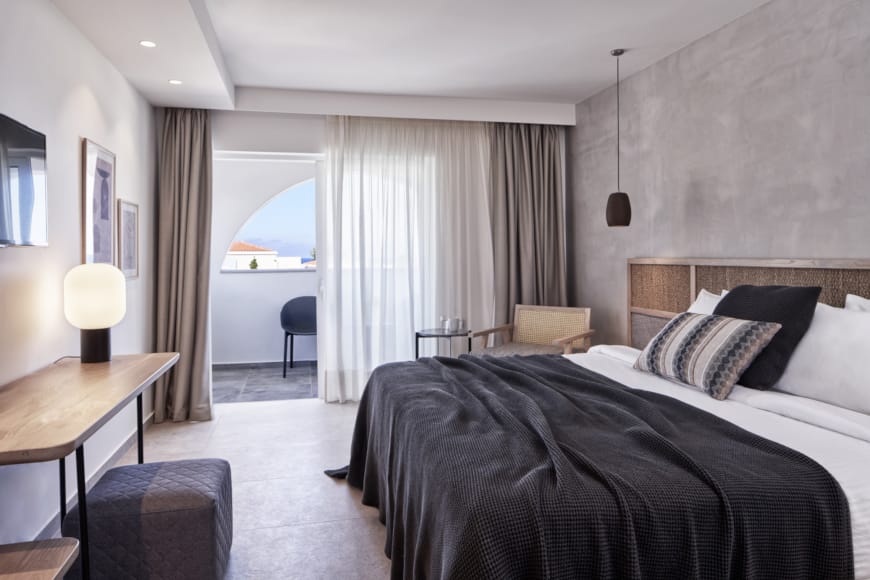 a bedroom with a bed and a desk