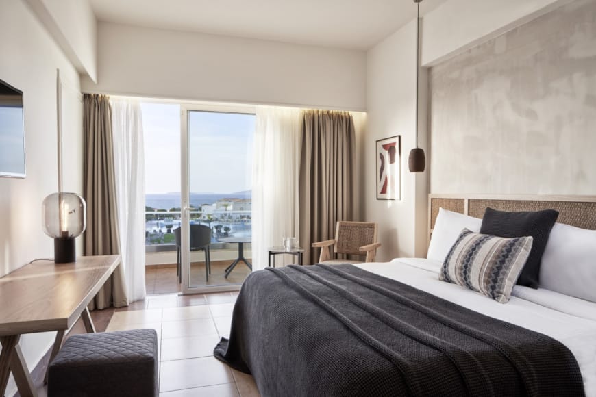 a bedroom with a large window