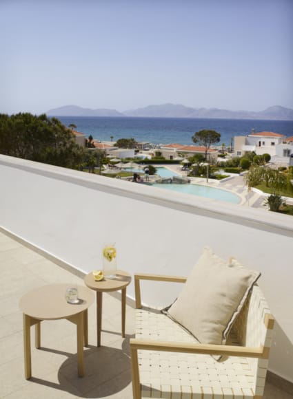 a pool with a deck and chairs