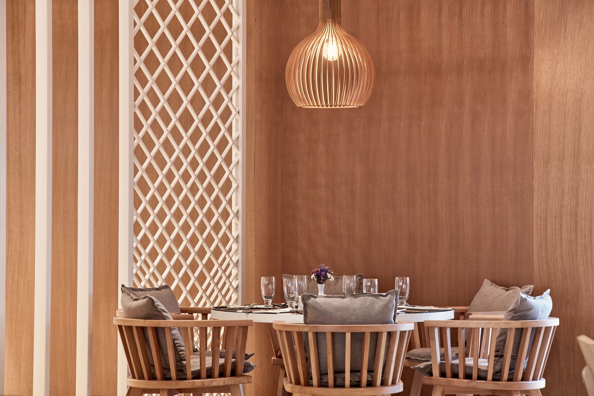 a table with a set of chairs and a chandelier