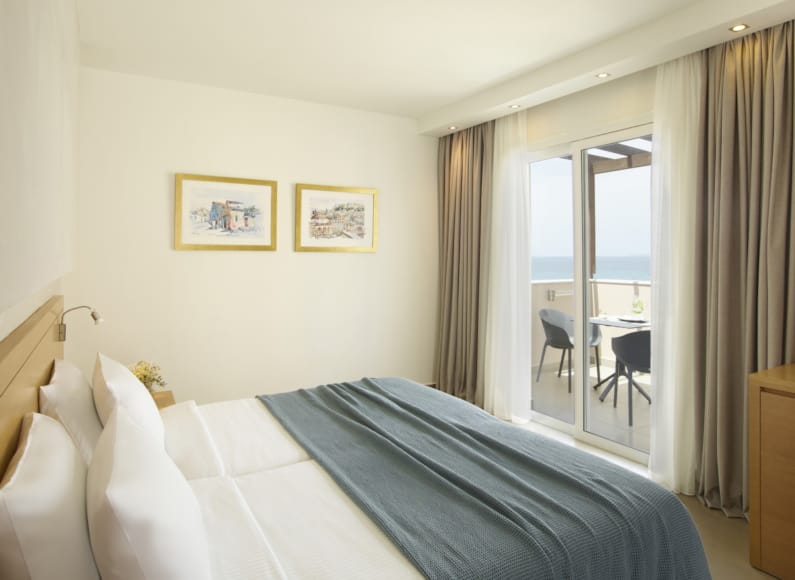 a hotel room with a bed and a table