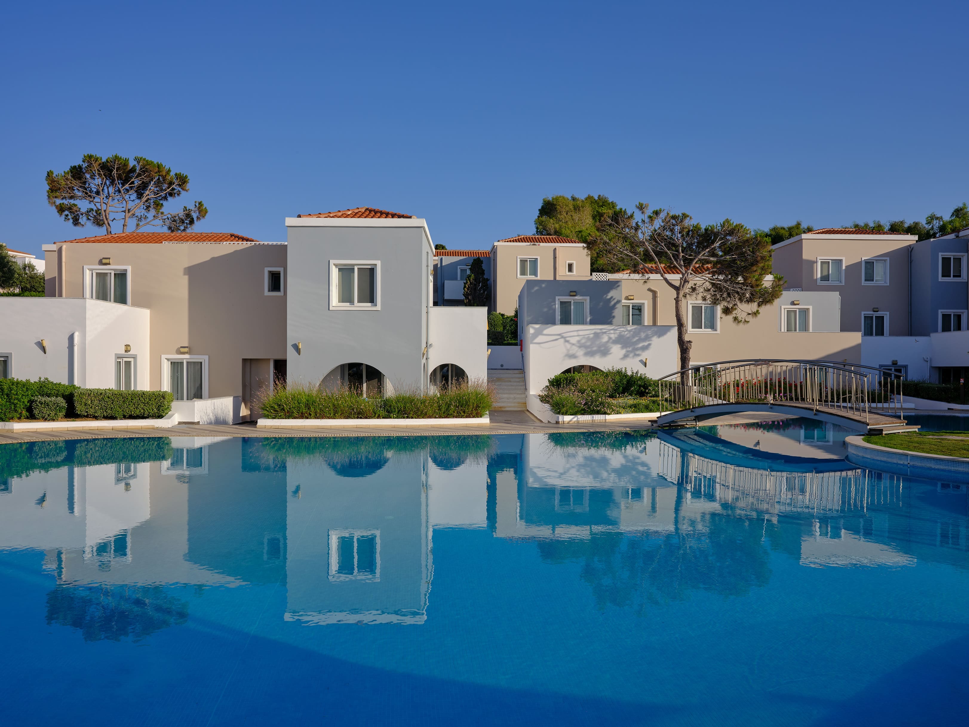 a pool with houses in the background