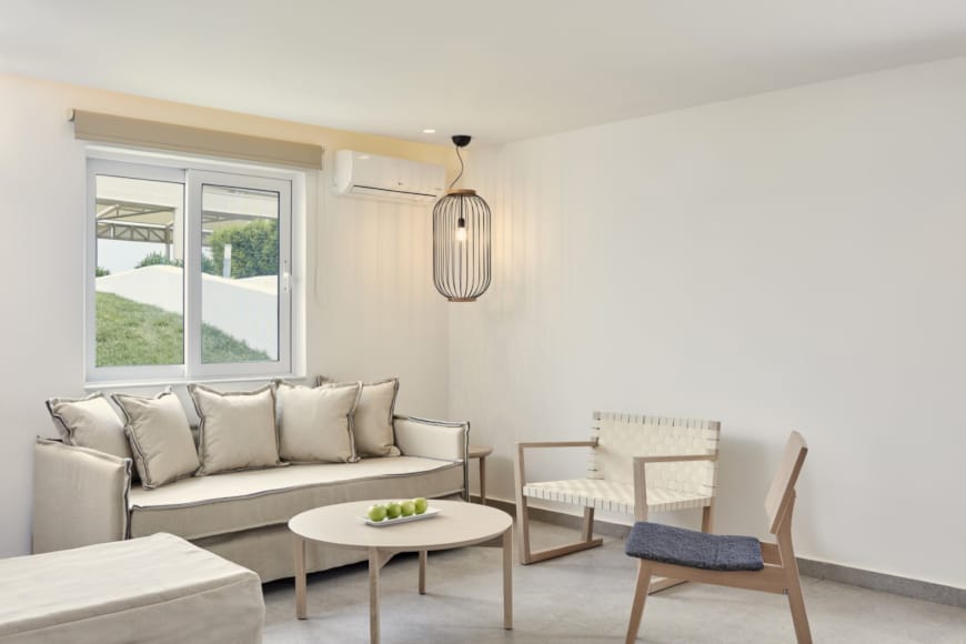 a living room with a white couch and a table