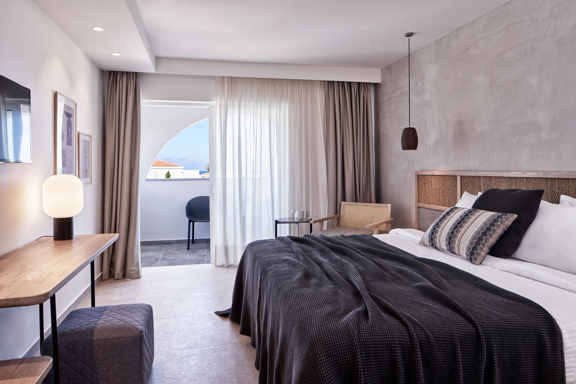 a bedroom with a bed and a desk