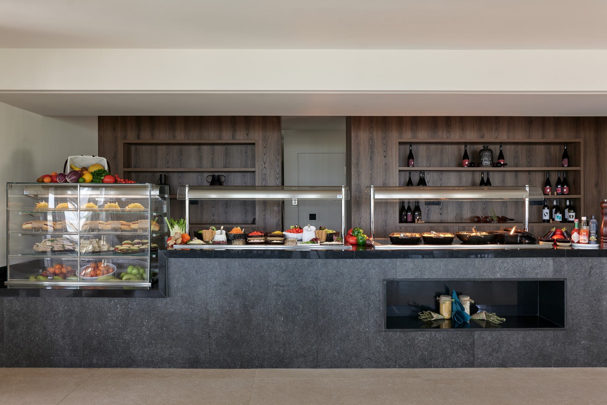 a kitchen with a large display of food