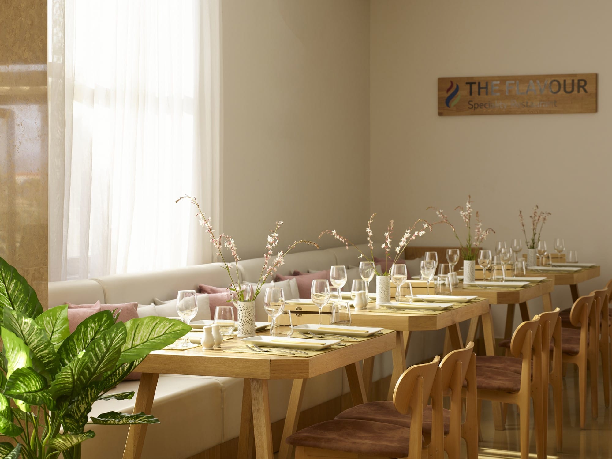 a set of tables with empty glasses
