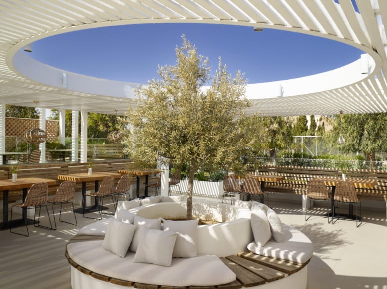 a group of tables and chairs outside