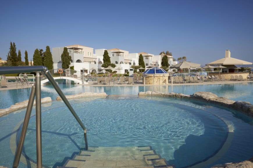 a pool with a building in the background