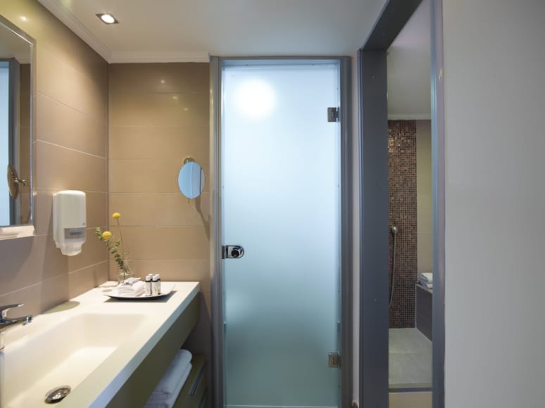 a bathroom with a glass door