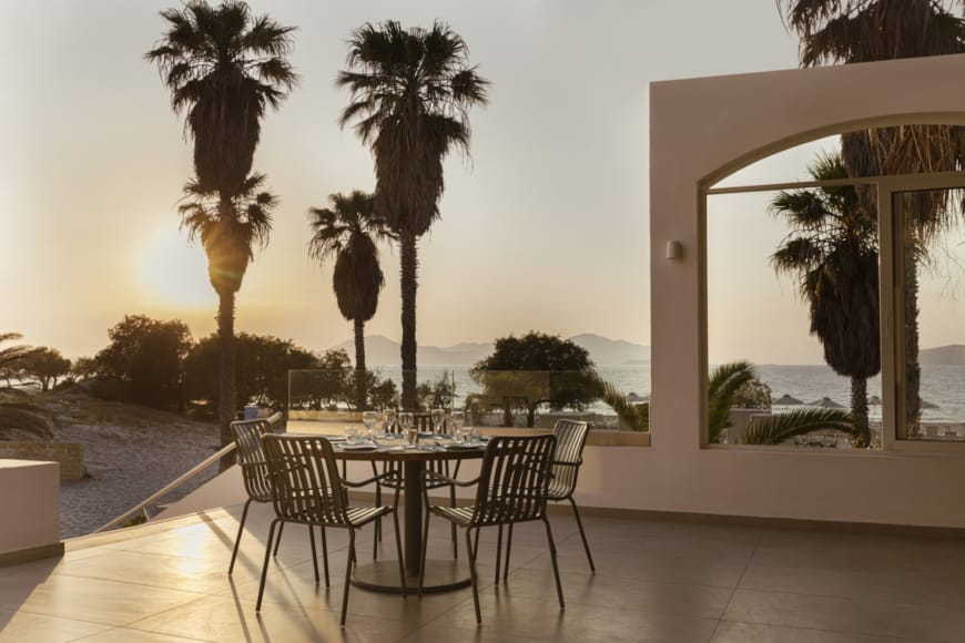 a table and chairs on a deck