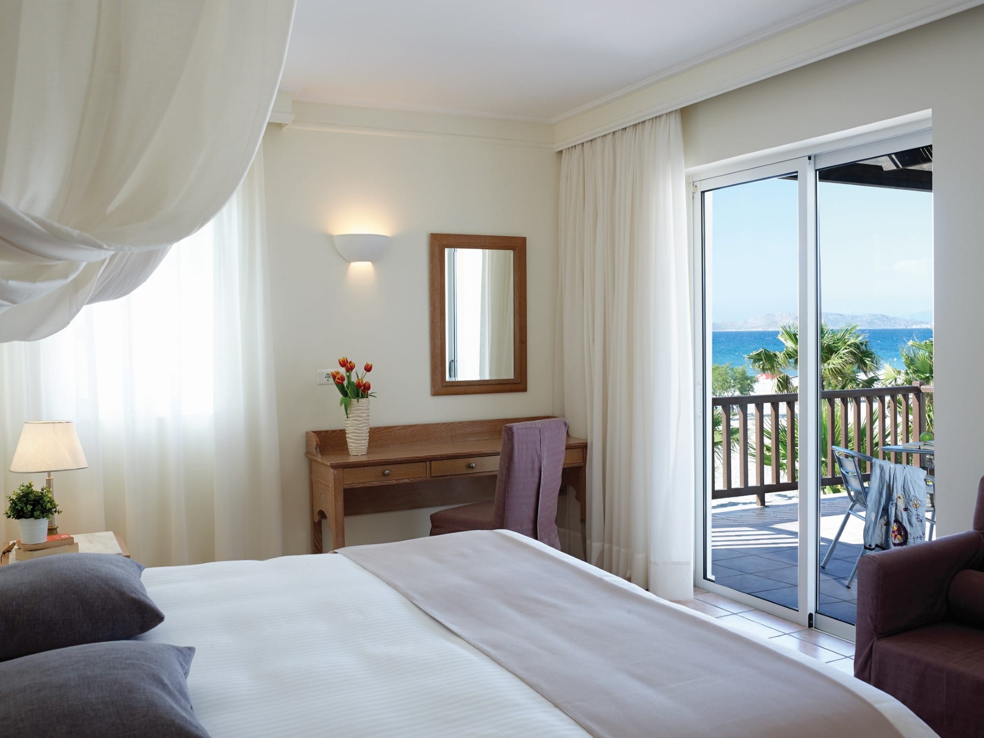 a bedroom with a large glass door