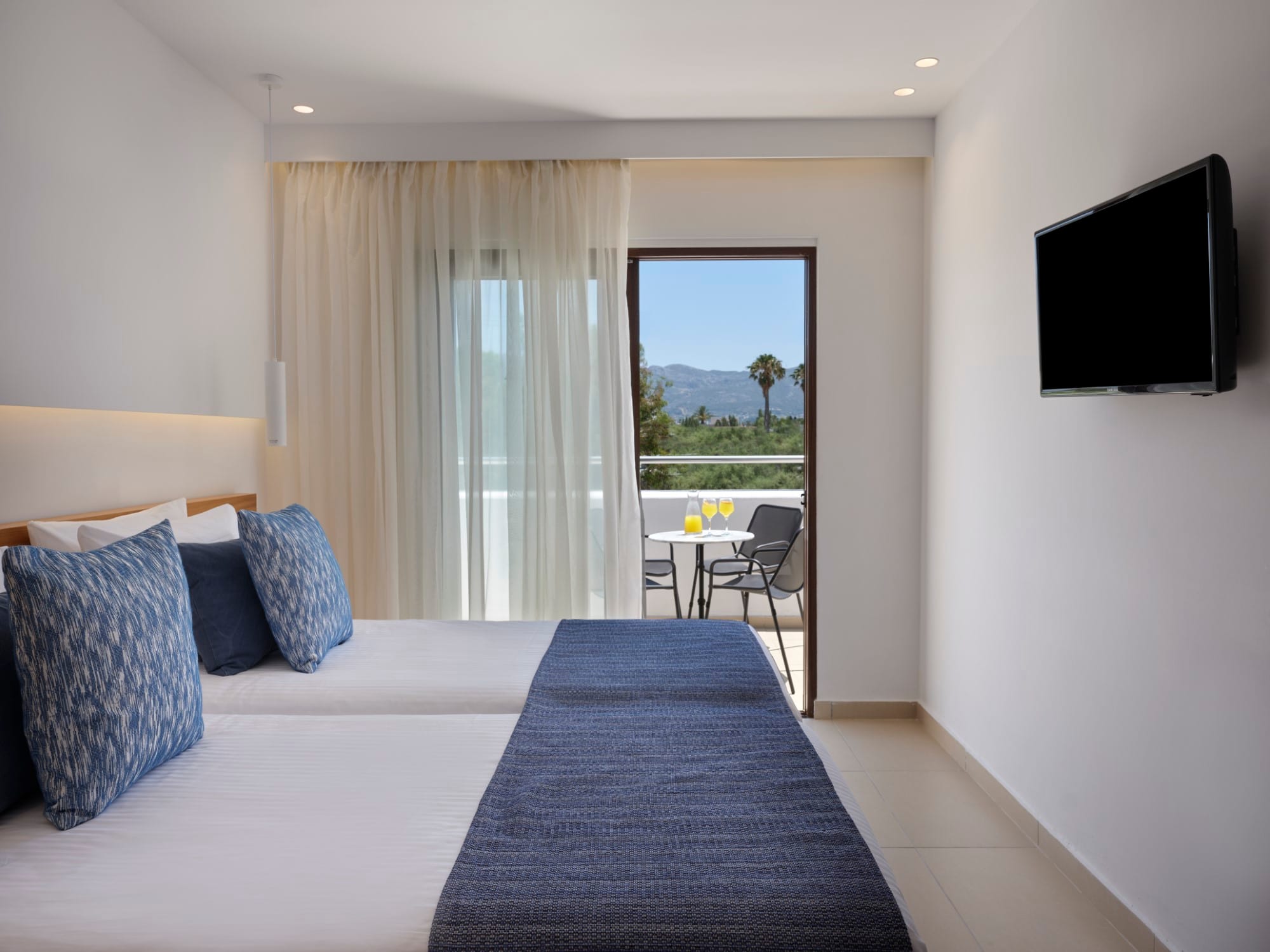 a bedroom with a large window