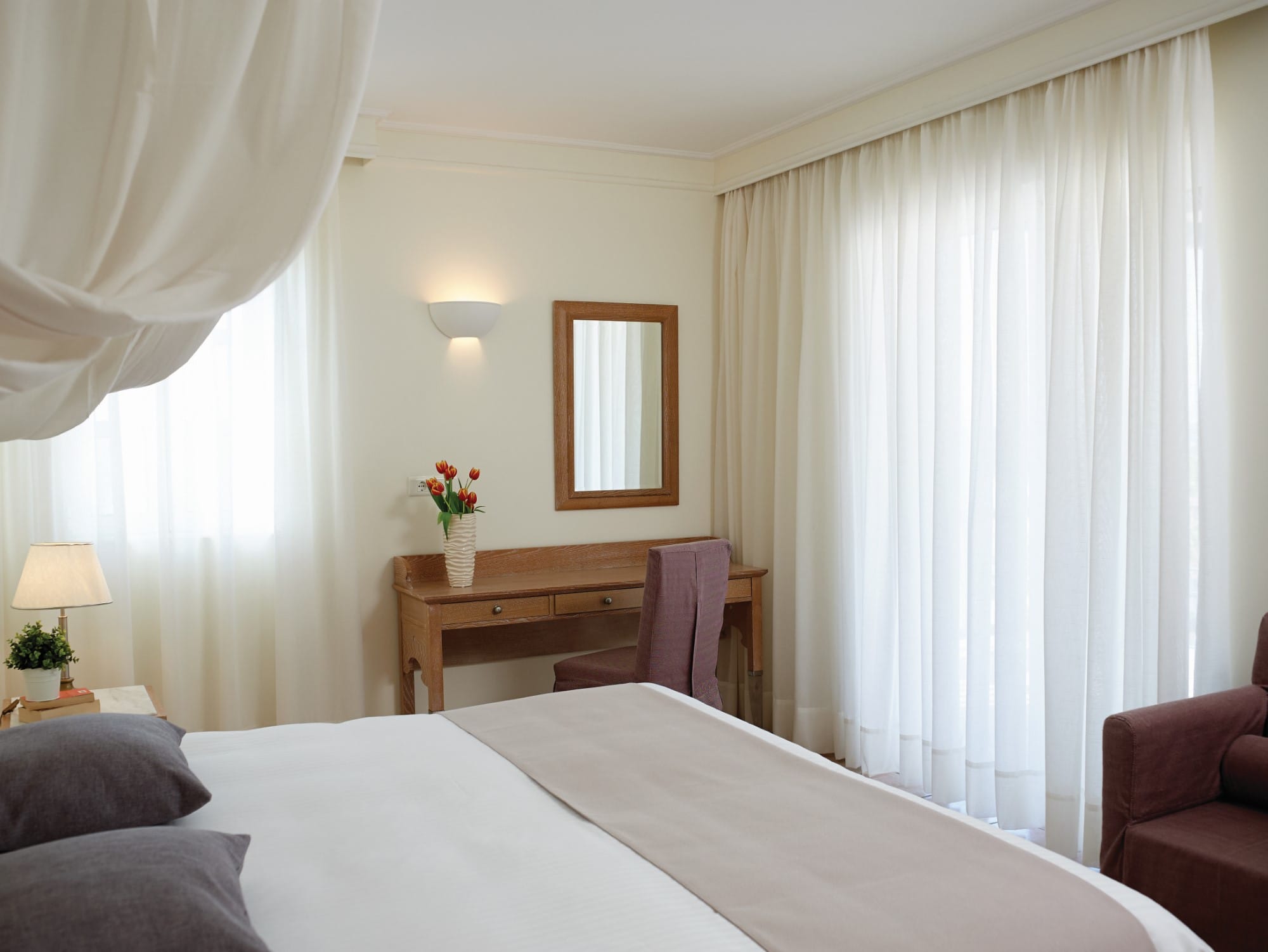 a bedroom with a bed and a mirror