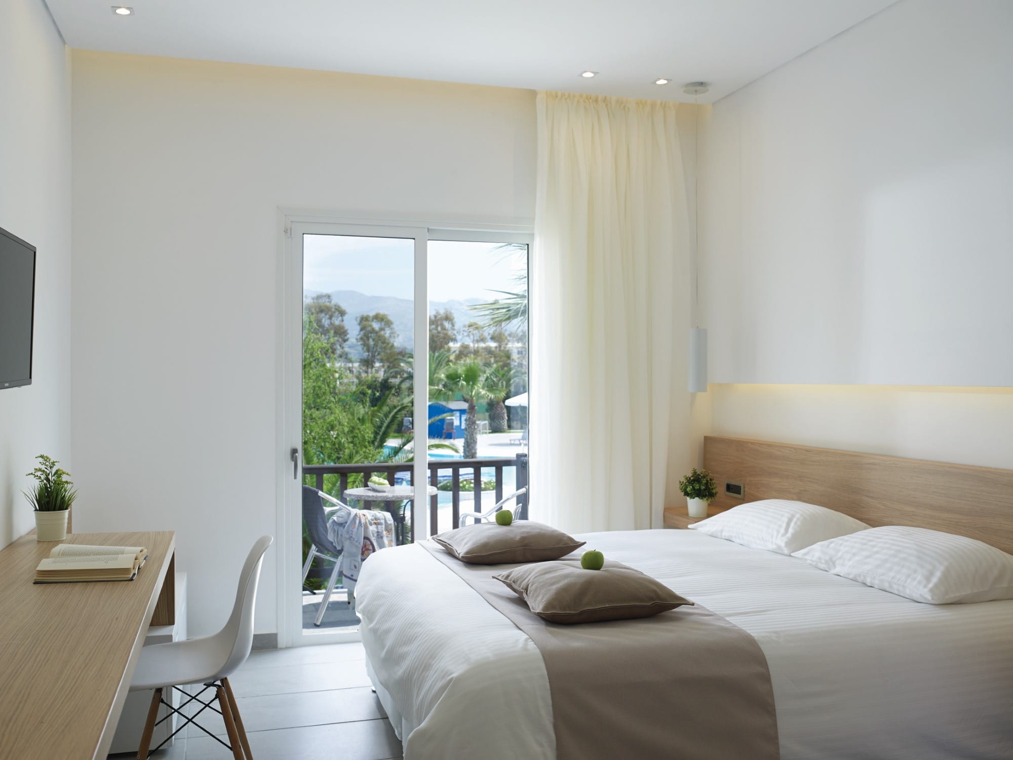 a bedroom with a large window