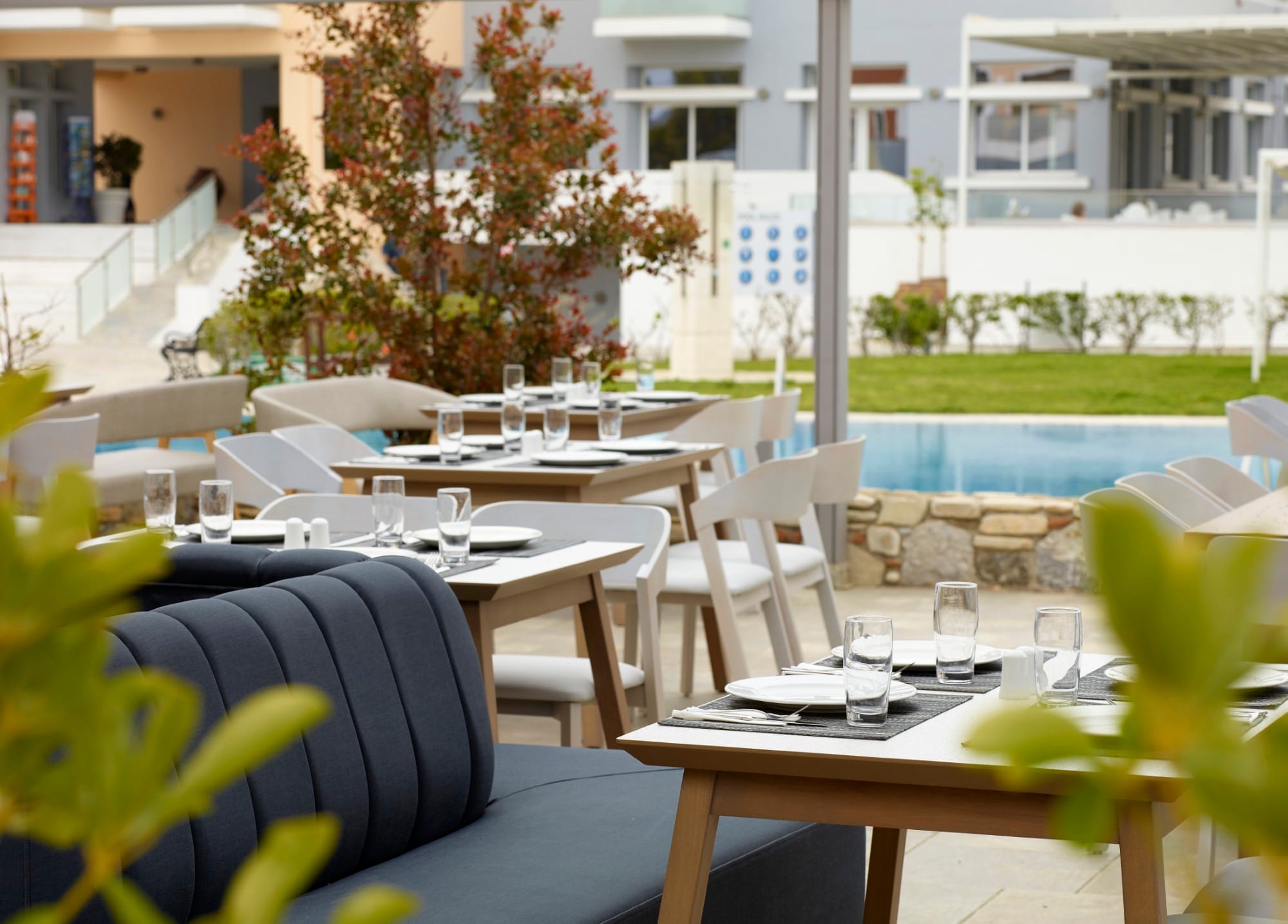 a pool with tables and chairs