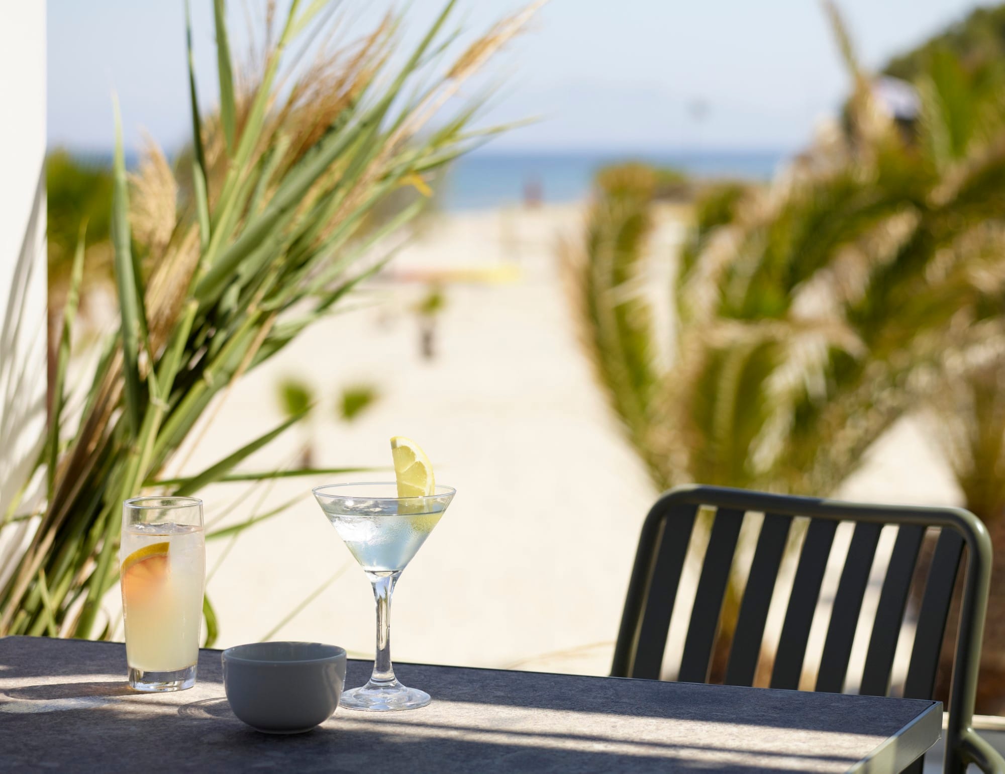 a table with a glass of wine and a couple of glasses of wine