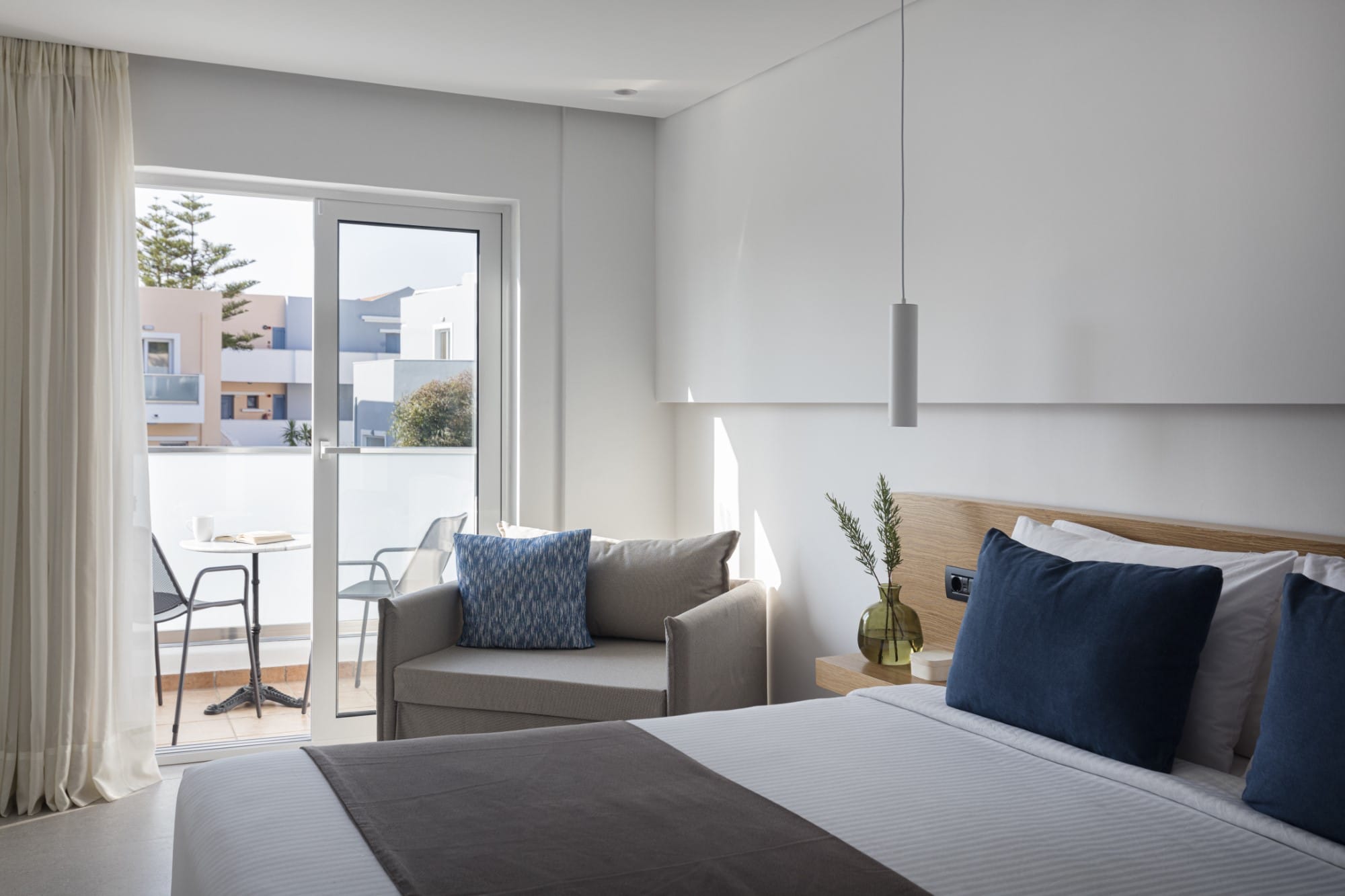 a bedroom with a bed and a couch