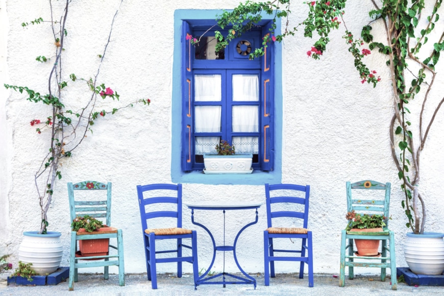 a group of chairs outside a house