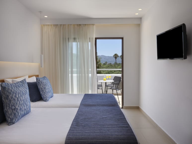 a bedroom with a large window