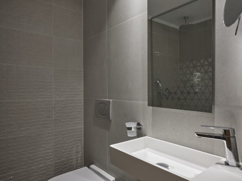 a bathroom with a large mirror