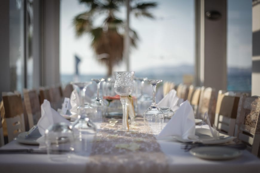 a table with glasses and plates