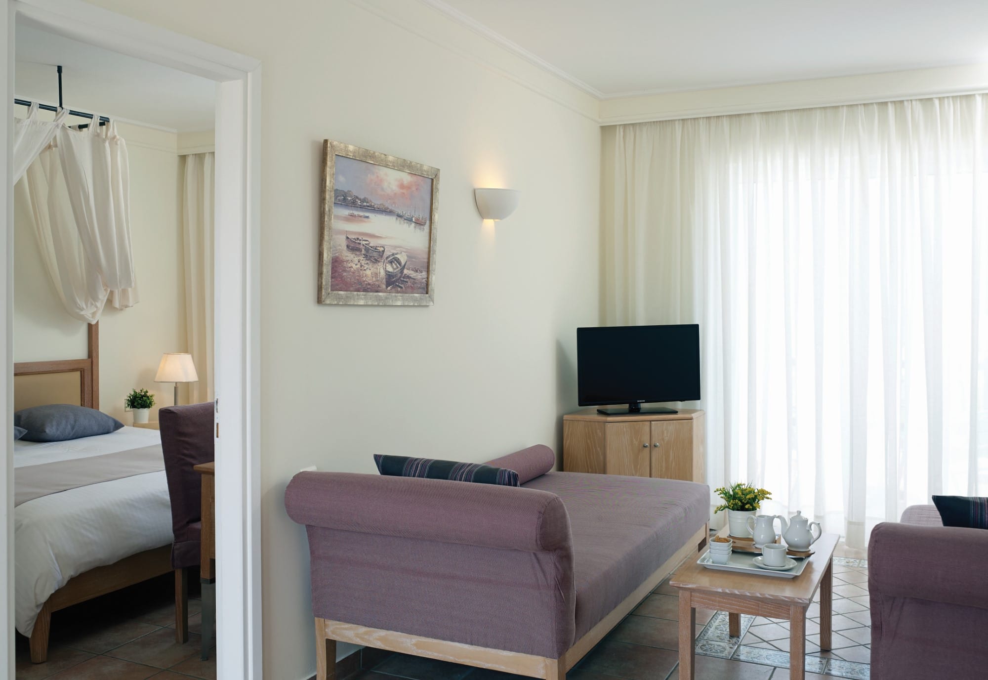a living room with a pink couch