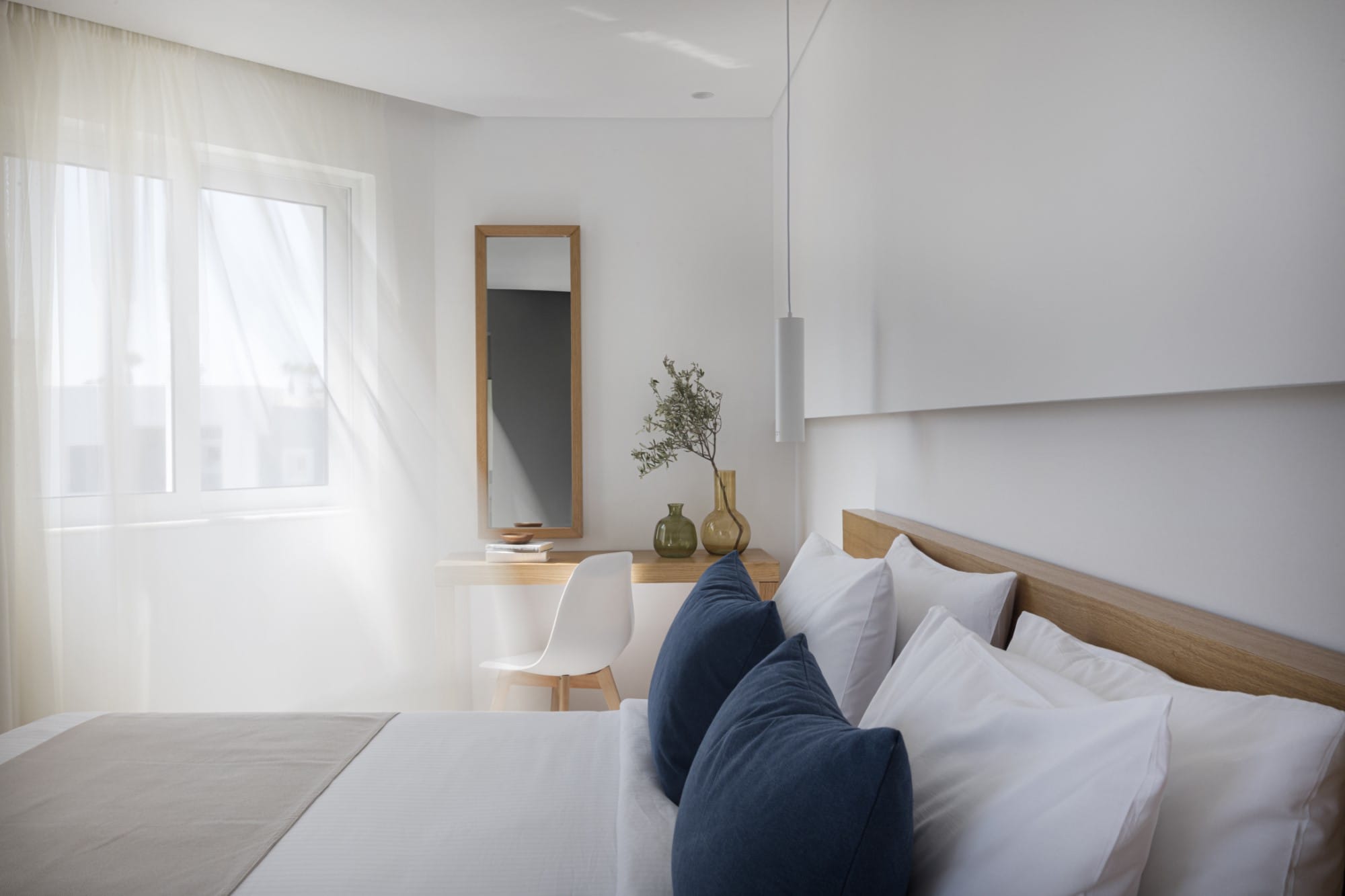 a bedroom with a bed and a table