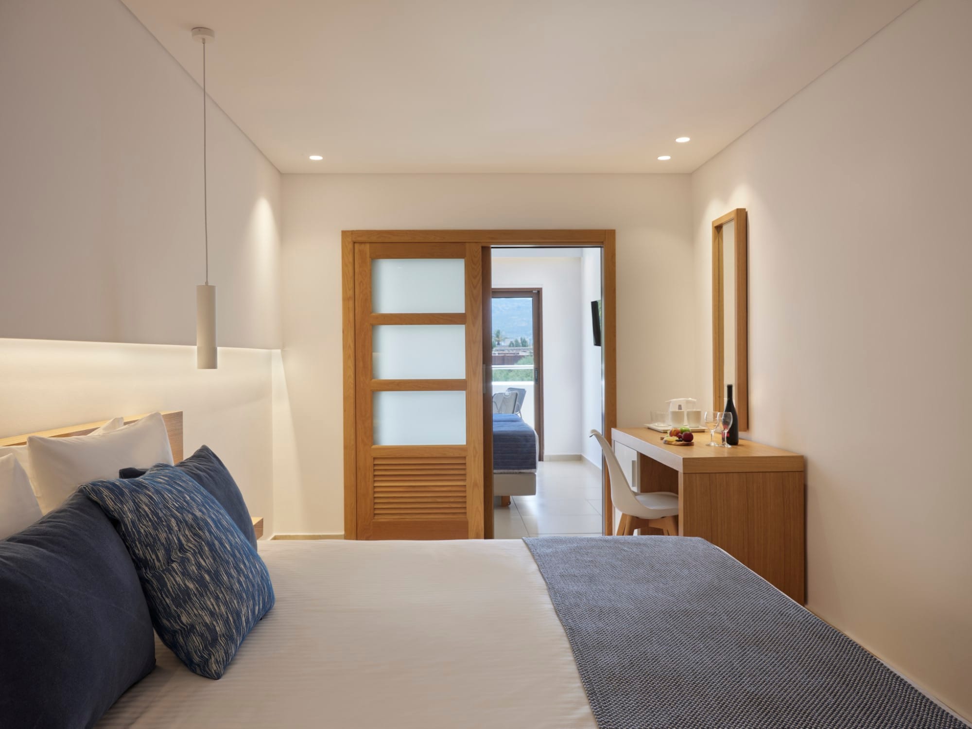 a bedroom with a bed and a desk