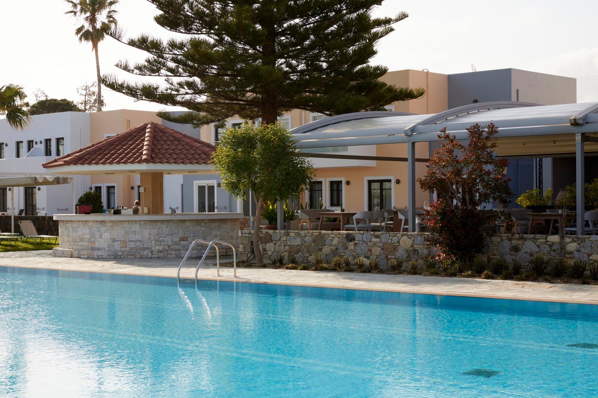 a swimming pool in front of a house