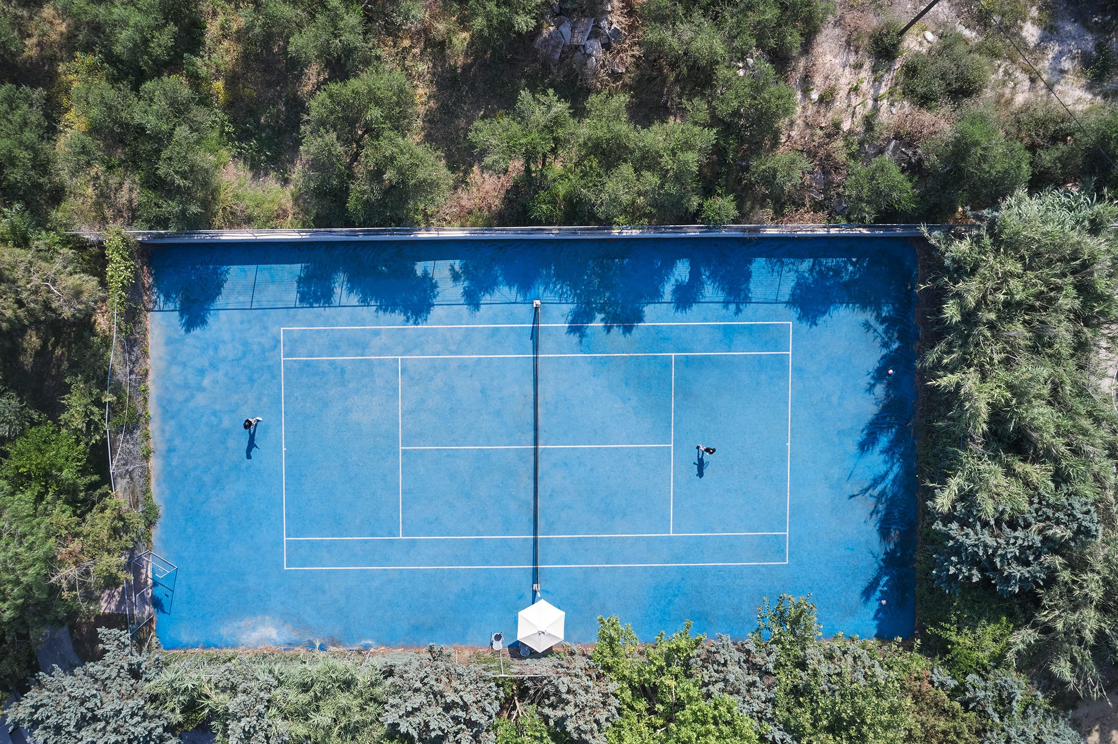 a blue rectangular sign with white text