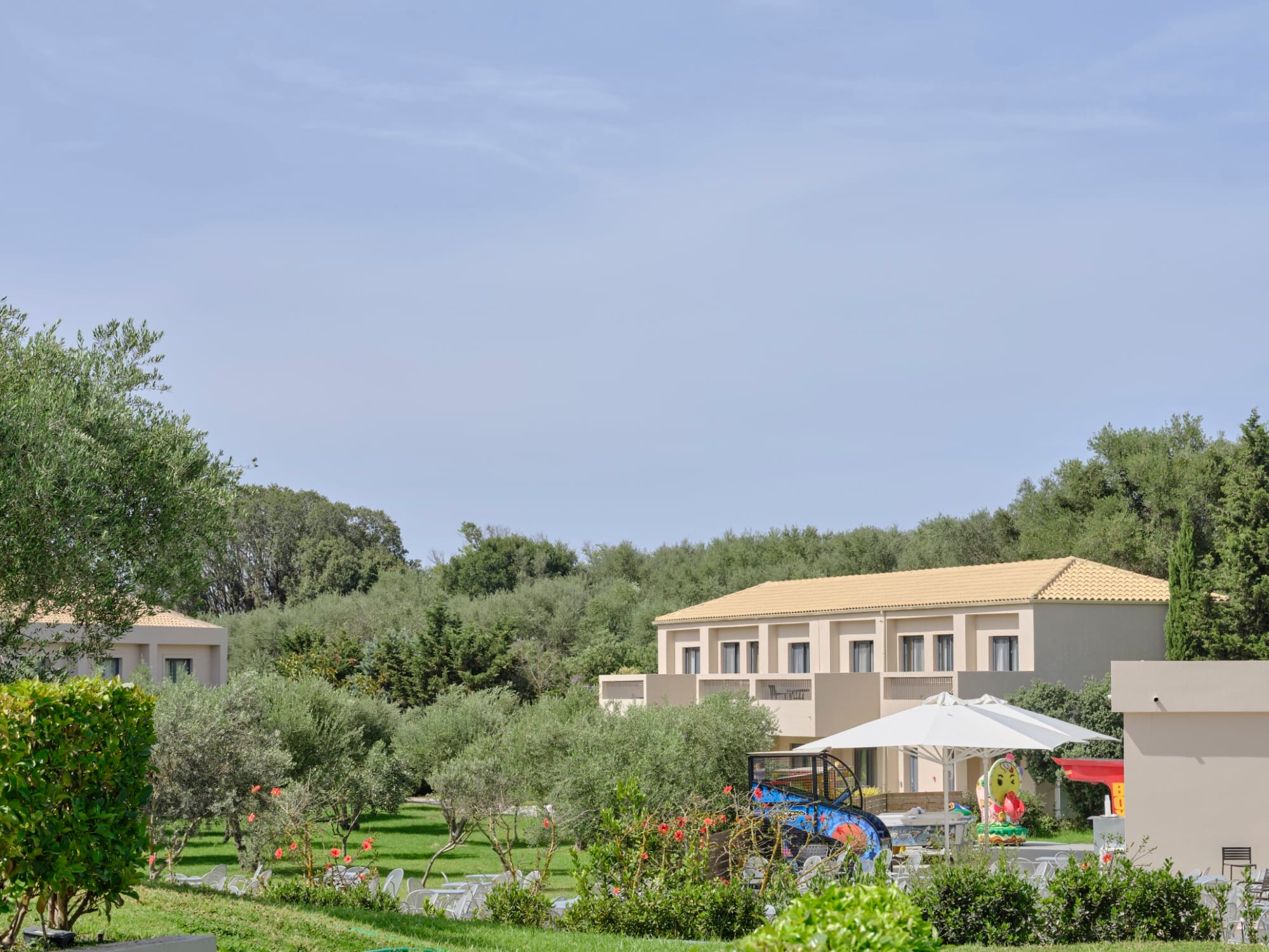 a building with trees and bushes around it