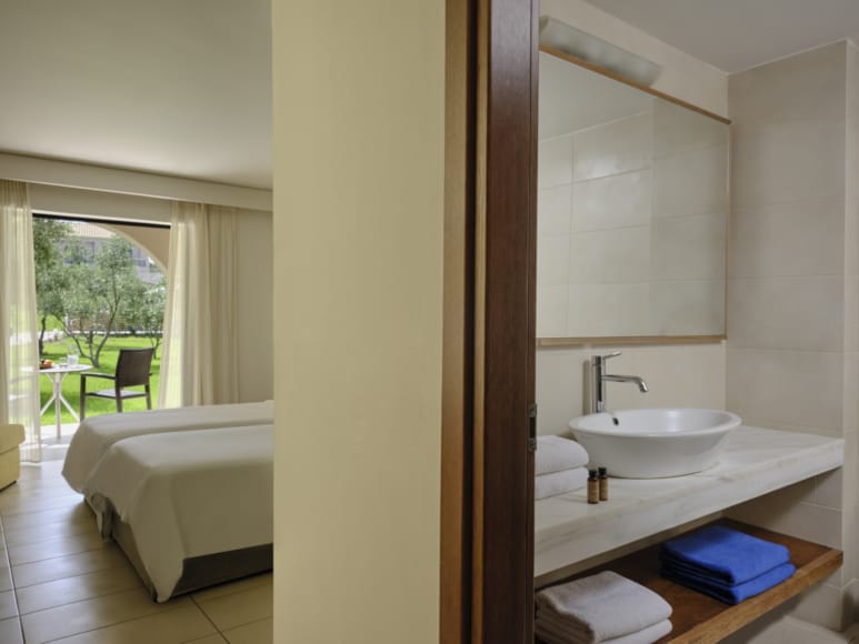 a bathroom with a tub sink and toilet